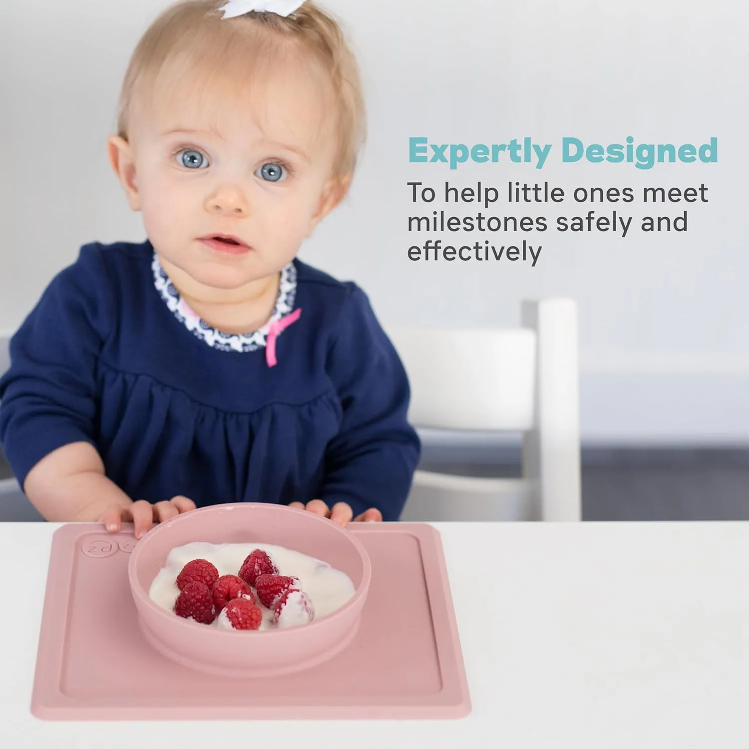 ezpz Mini Bowl for 12 Months  (Blush) - 100% Silicone Suction Bowl with Built-in Placemat for Toddlers - Comes with a Reusable Travel Bag
